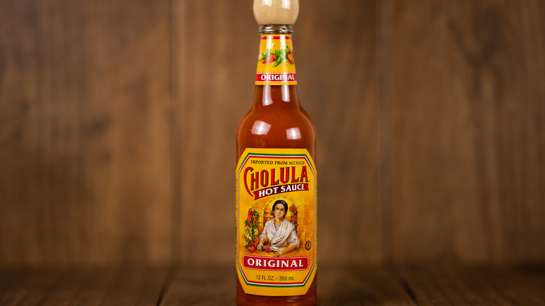 Cholula bottle and wooden panels