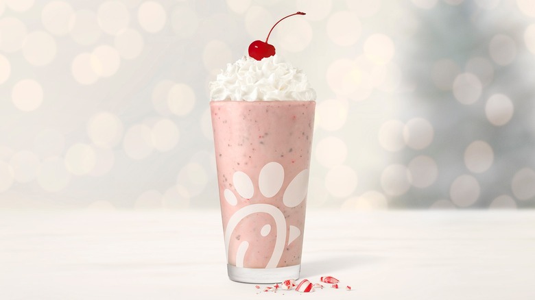 Chick-fil-A peppermint milkshake with whipped cream and cherry
