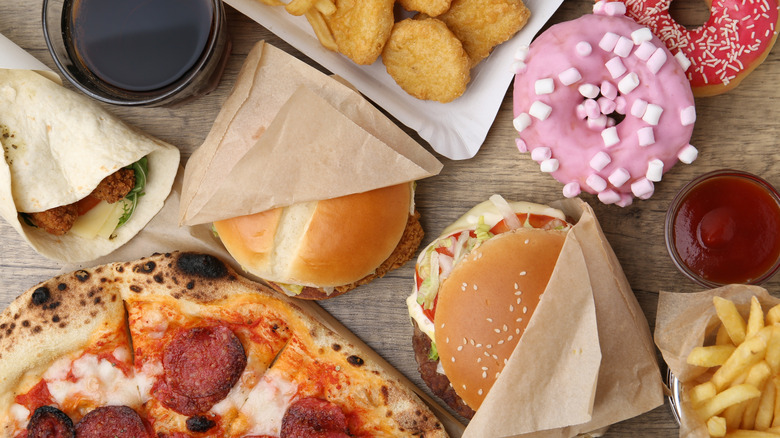 Overhead view of assorted fast food items on table