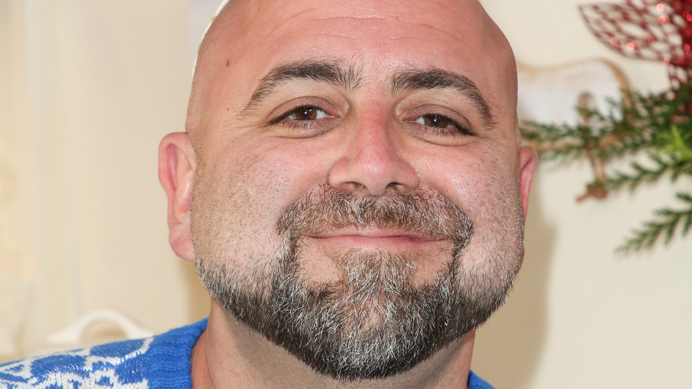 Duff Goldman half smiling