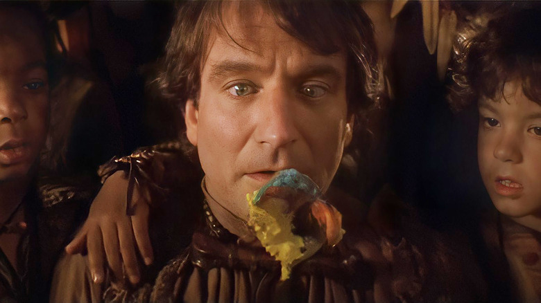 Robin Williams in movie Hook with colorful spoon