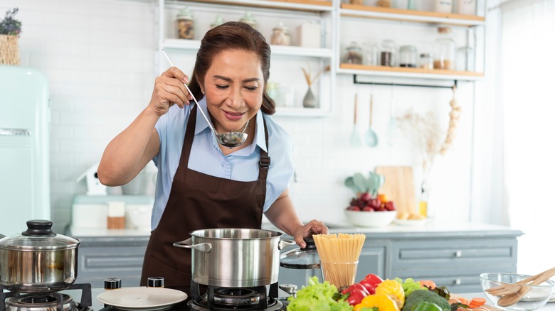 Woman taste testing the food