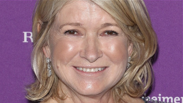 Martha Stewart, smiling with dangly earrings