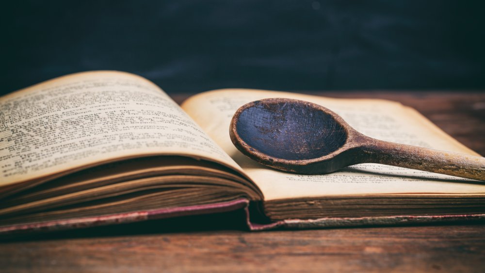 wooden ladle on cookbook