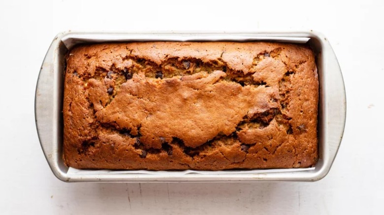 A loaf of banana bread in a baking pan