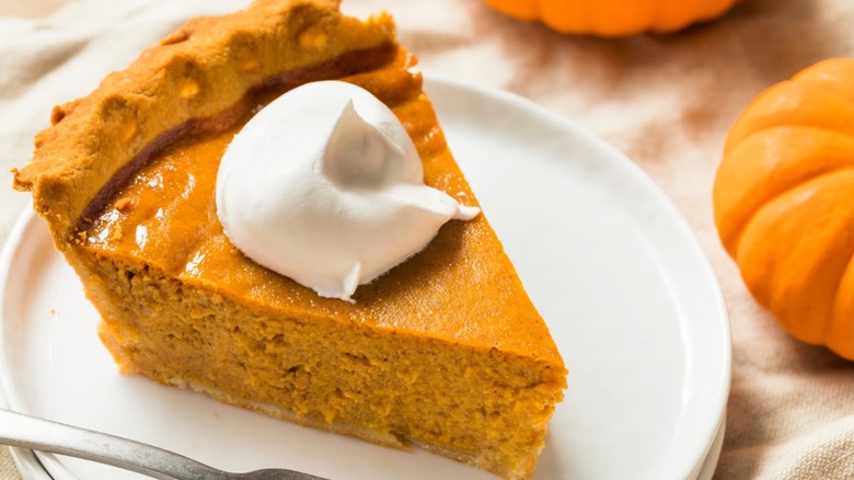 pumpkin pie slice with cream