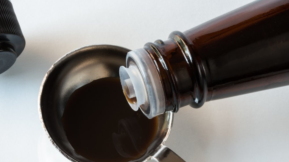 Worcestershire sauce being measured