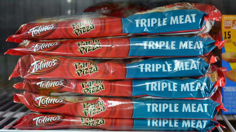 Stack of frozen Totino's Party Pizza in Triple Meat Flavor