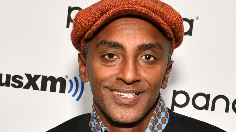 Marcus Samuelsson in orange hat