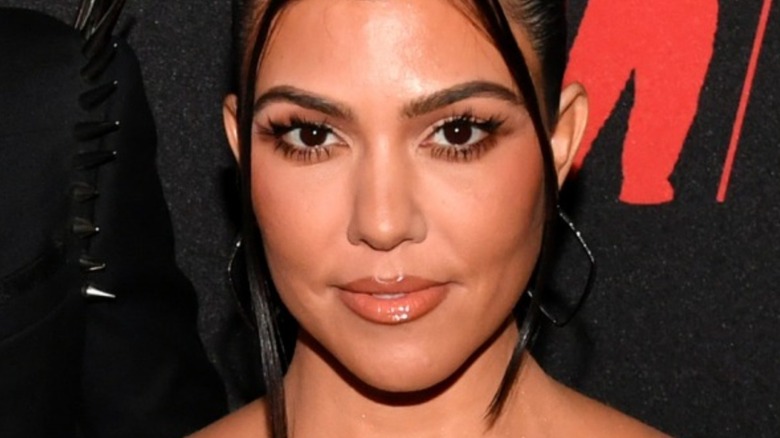 Kourtney Kardashian black earrings