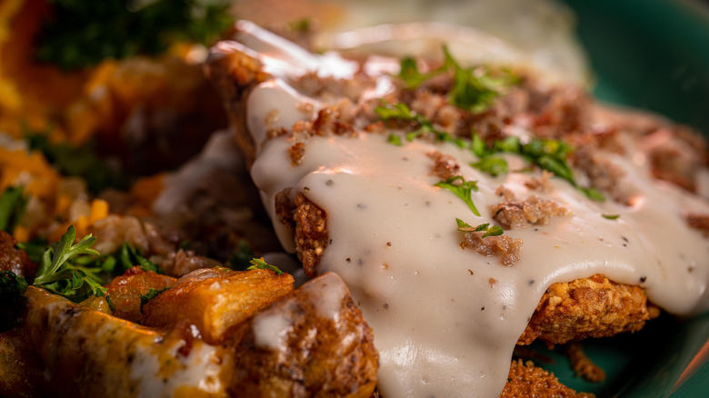 Chicken fried steak with gravy and potatoes 