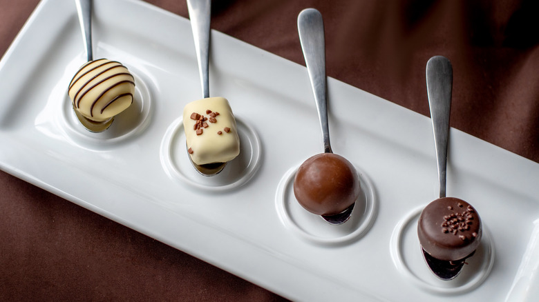 Fancy spoons adorned with chocolate truffles