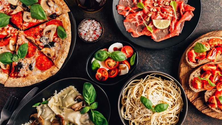 variety of italian dishes on a table