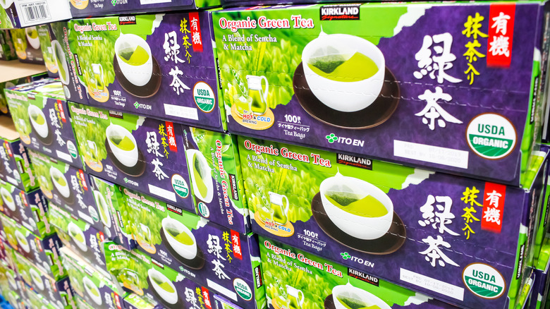 boxes of kirkland signature green tea on shelves at costco