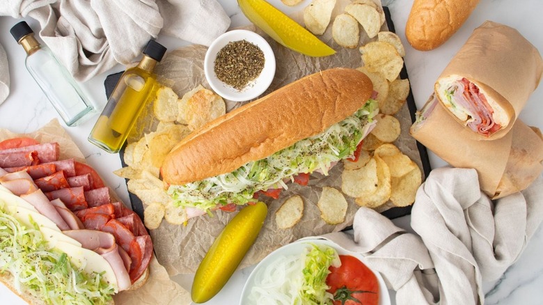 Jimmy John's Italian Night Club sandwiches surrounded by chips and pickles