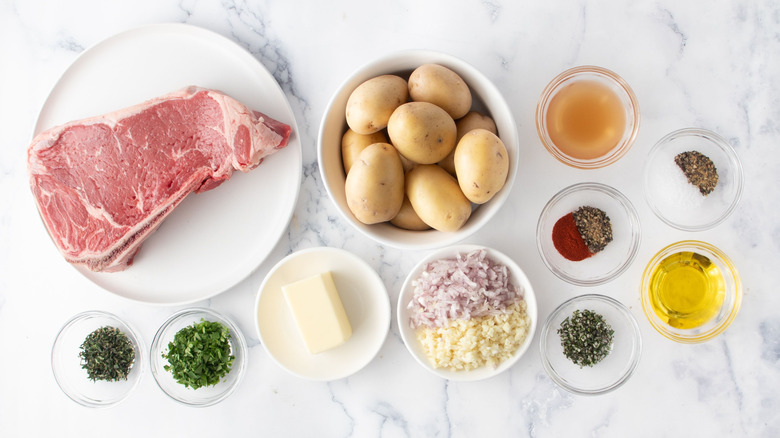 Ingredients for garlic steak and potatoes