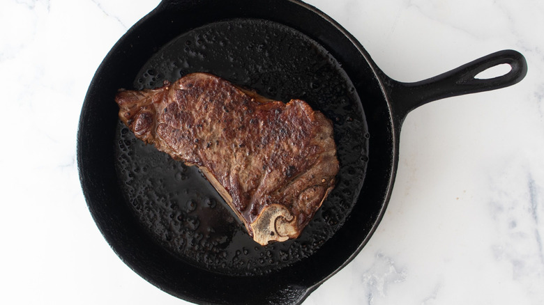 Seared steak in cast iron skillet
