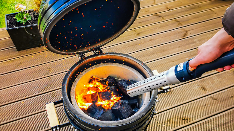 Kamado grill and lit charcoal