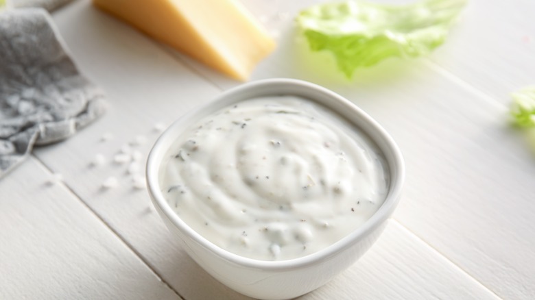 cup of Caesar dressing 