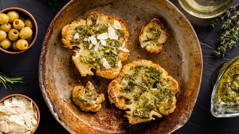 seasoned and sauced cauliflower steaks