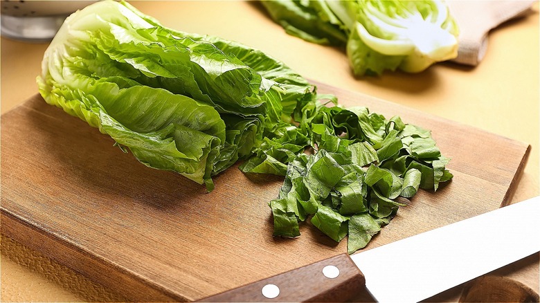 Romaine lettuce chopped on a cutting board