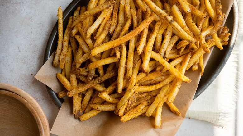 French fries on brown paper