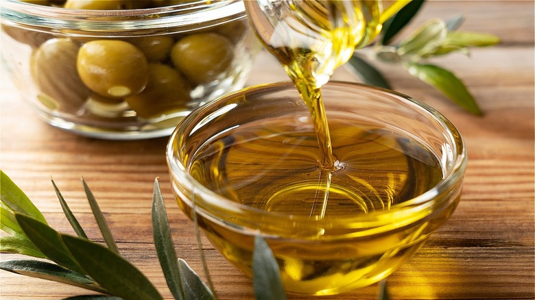 Olive oil being poured into a bowl