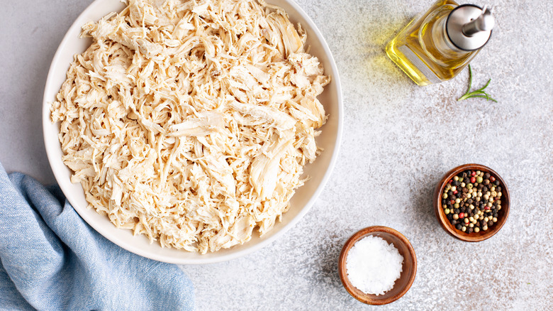 Shredded chicken in a white bowl