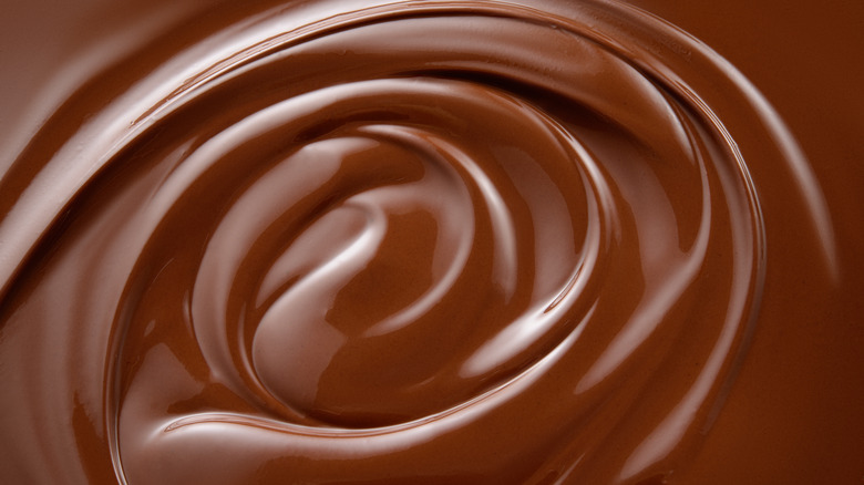 swirled melted chocolate shining enticingly
