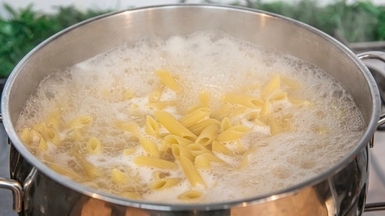 a pot of boiling pasta noodles