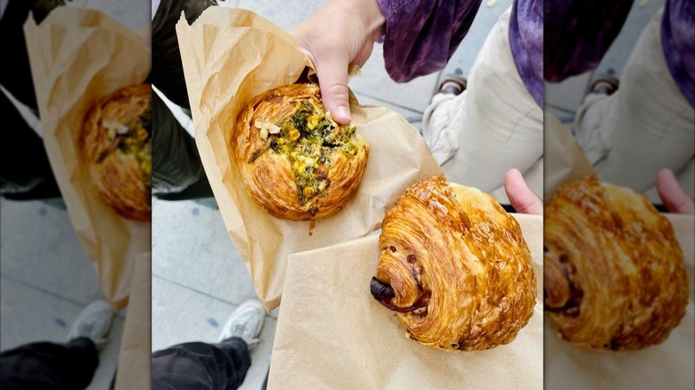 People holding pastries from Proof