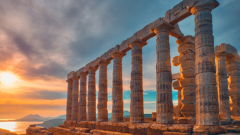 seaside ancient Greek ruins at sunset