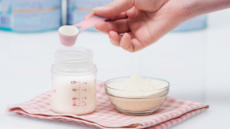 Making bottle with baby formula