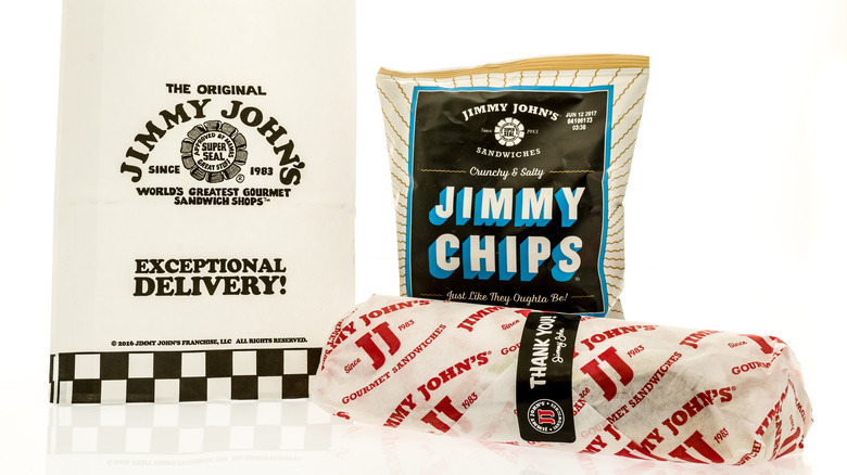 Jimmy John's paper bag, chips, and wrapped sandwich