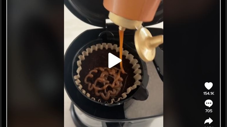 Caramel syrup being drizzled into coffee filter