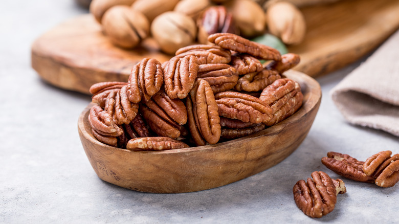 Wooden bowl of pecans