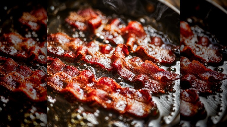 Bacon and bacon grease in a skillet.