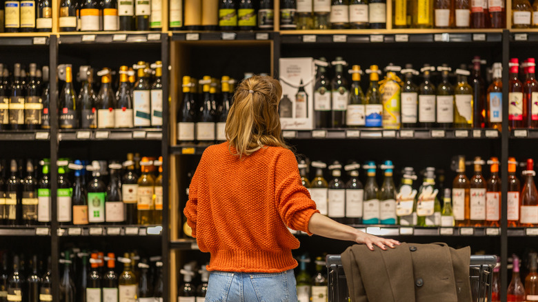 Person shopping in a liquor store