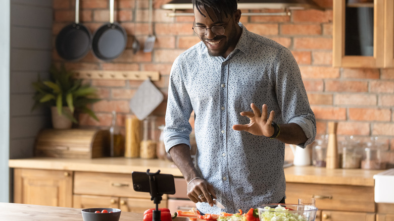 man filming his cooking