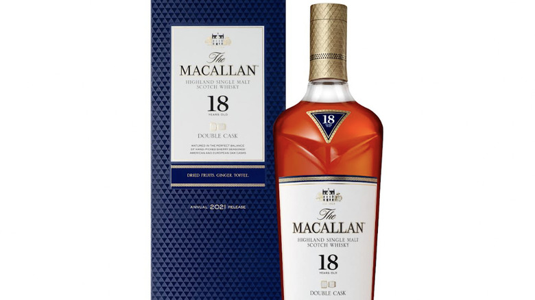 The Macallan brand whisky next to highball glass