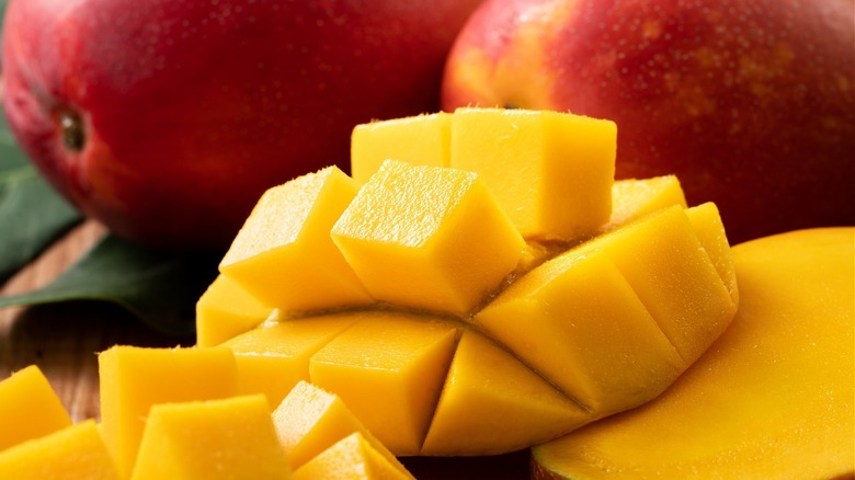 Wedges and cubes of fresh mango.