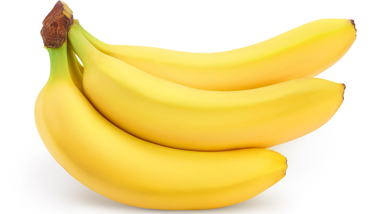 Bananas in a bunch on white background