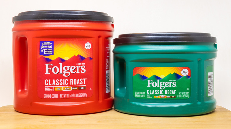 Folger's coffee canisters on wood block