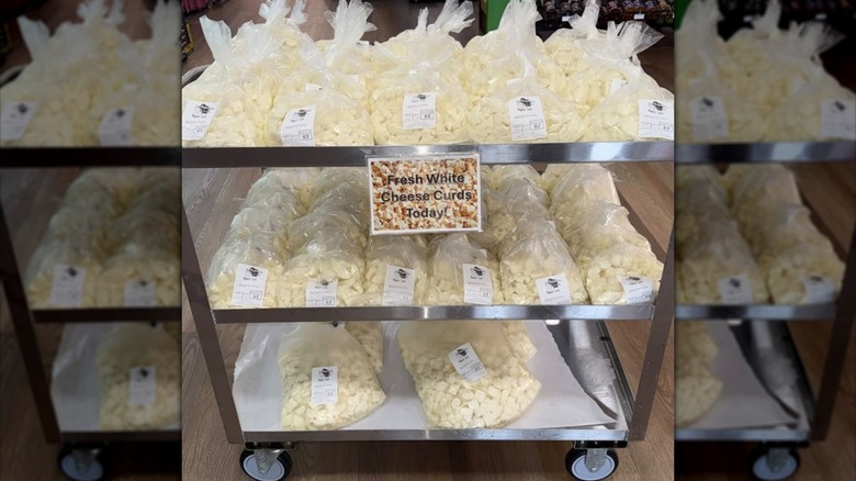 Bags of LaGrander's cheese curds on rolling cart.