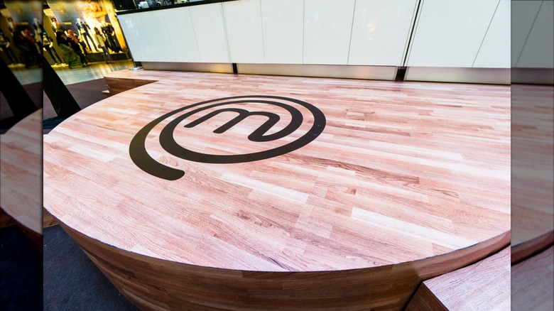 wooden table with MasterChef logo