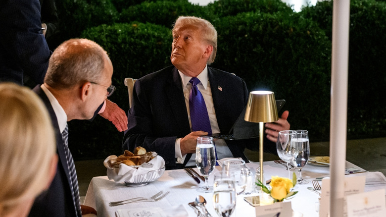 Donald Trump eating dinner outside the White House