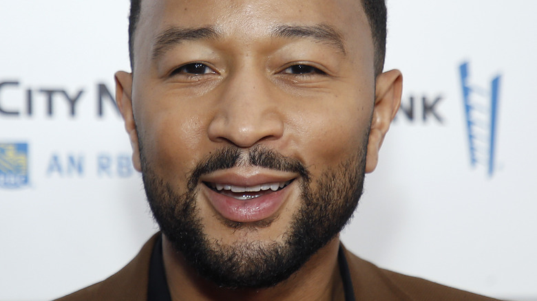 John Legend wearing brown sports coat