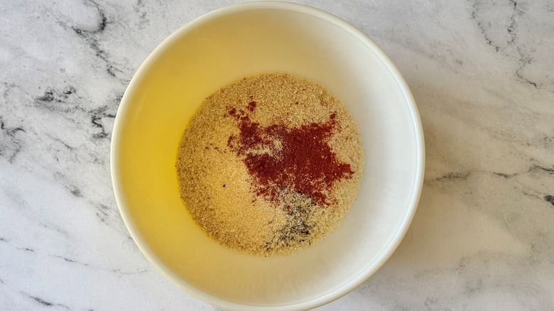 Breadcrumbs and seasonings in bowl