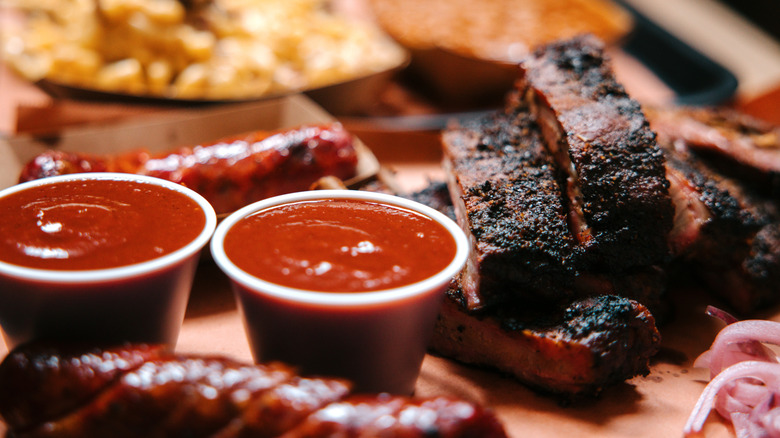 Plate of BBQ meat and sauces