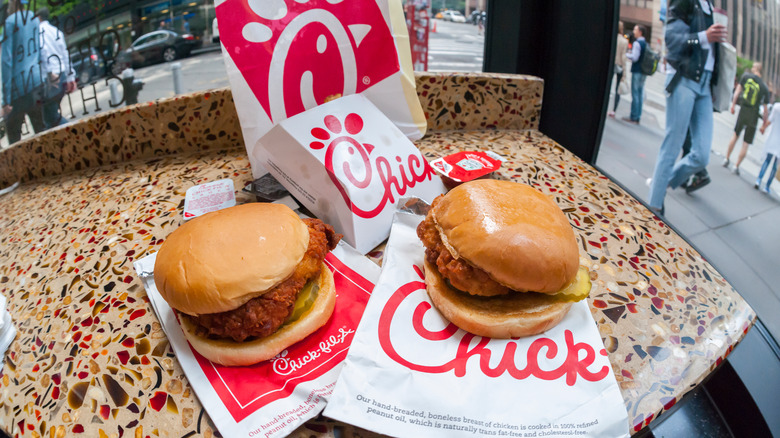Fried chicken sandwiches on a beige table